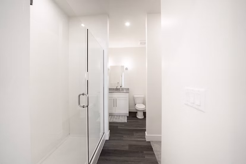 Modern bathroom featuring sleek fixtures and marble countertops at Klein Huis, Turner Mill Apartments