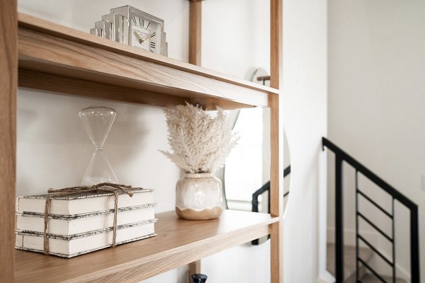 Hallway decorated with contemporary art and elegant lighting at Klein Huis at Turner Mill Apartments, offering a luxurious living experience