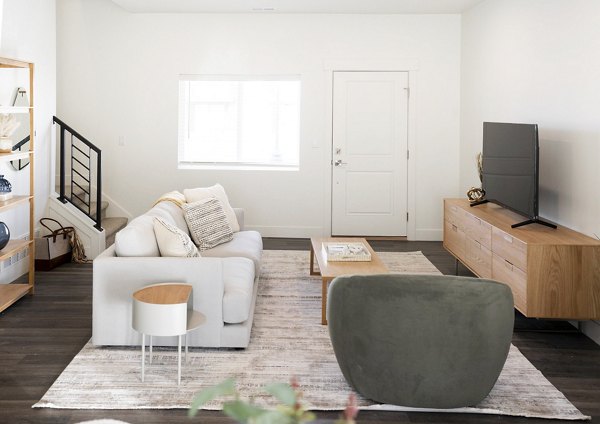Open-concept living room with modern decor at Klein Huis, Turner Mill Apartments, ideal for luxury apartment living in a vibrant community
