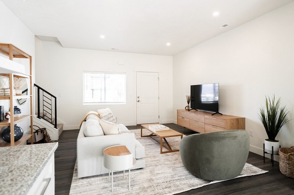 Spacious living room with modern decor at Klein Huis, Turner Mill Apartments, ideal for comfort and style
