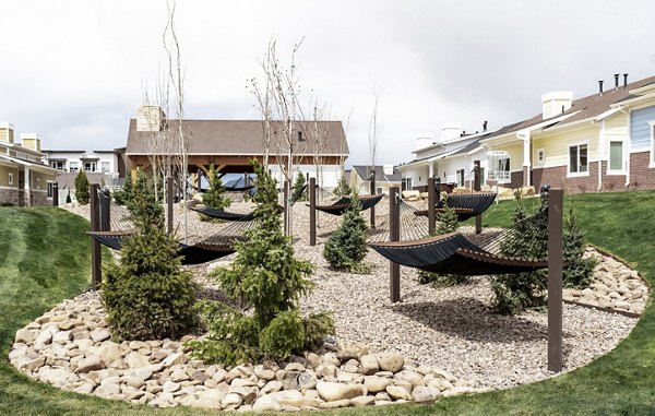 Tranquil courtyard with lush greenery at Milano Apartments, a Greystar luxury community