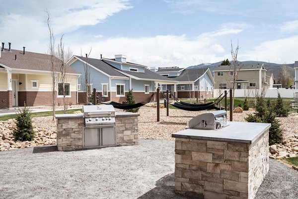 Outdoor grilling station with modern appliances at Milano Apartments