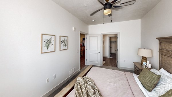 Cozy bedroom with a comfy queen bed and modern decor at Sequoia Apartments within Turner Mill Apartments