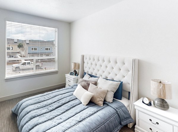 Cozy bedroom with modern design elements at Sequoia Apartments in Turner Mill, offering a relaxing retreat