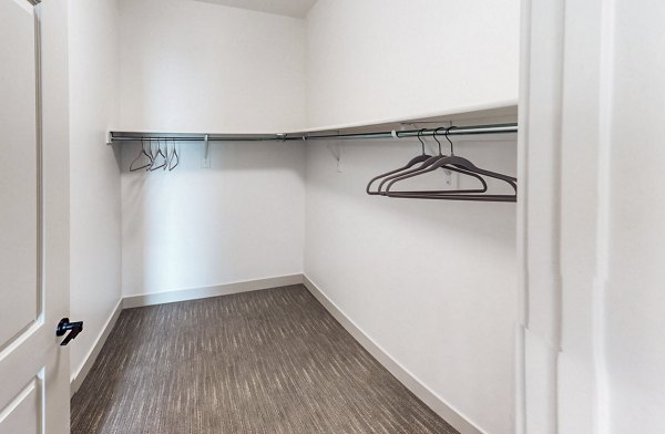 Organized bedroom closet with ample shelving at Sequoia Apartments in Turner Mill