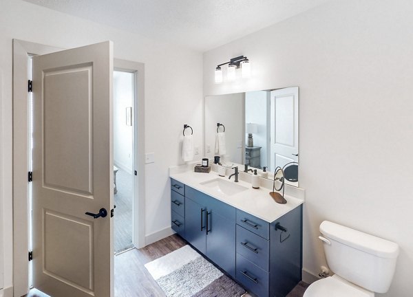 Modern bathroom with sleek fixtures in Sequoia Apartments at Turner Mill Bright, minimalist design for a luxury living experience