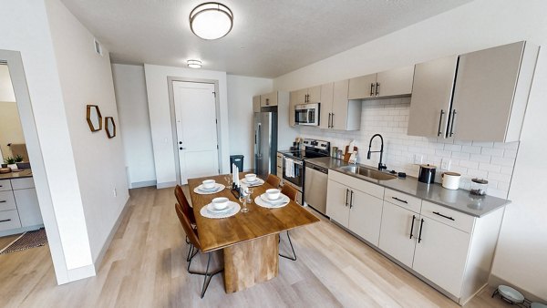 Modern kitchen with stainless steel appliances at Sequoia Apartments in Turner Mill