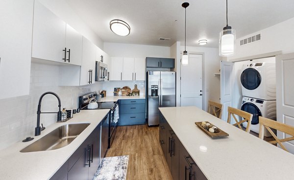 Modern kitchen with stainless steel appliances at Sequoia Apartments at Turner Mill Apartments