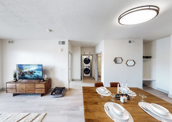 Dining and living room with modern decor at Sequoia Apartments in Turner Mill