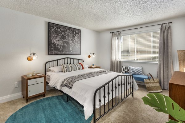 Cozy bedroom with modern furnishings at Alaire Apartment Homes Apartments