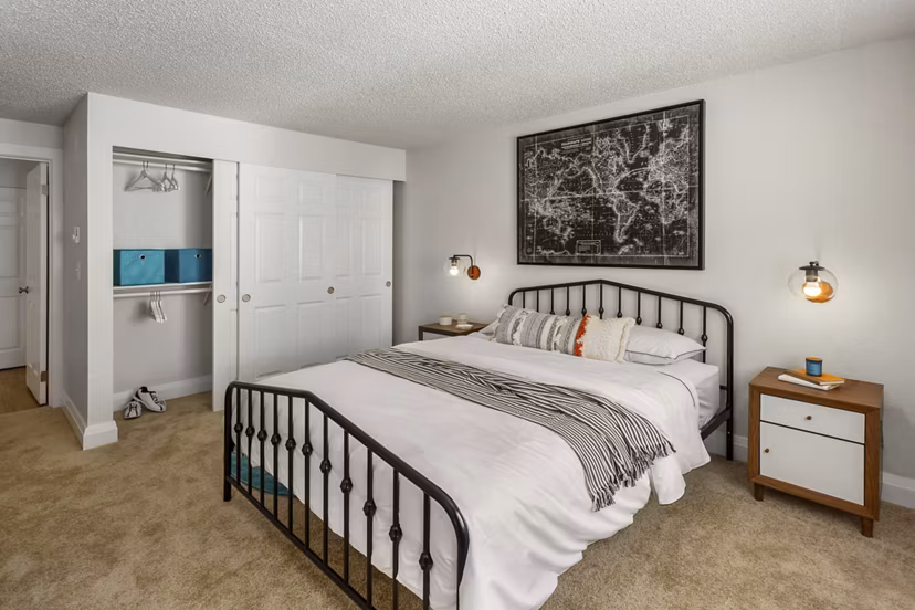 Cozy bedroom with modern decor at Alaire Apartment Homes, offering luxury living