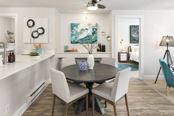 Dining area with stylish decor and modern furniture at Alaire Apartment Homes