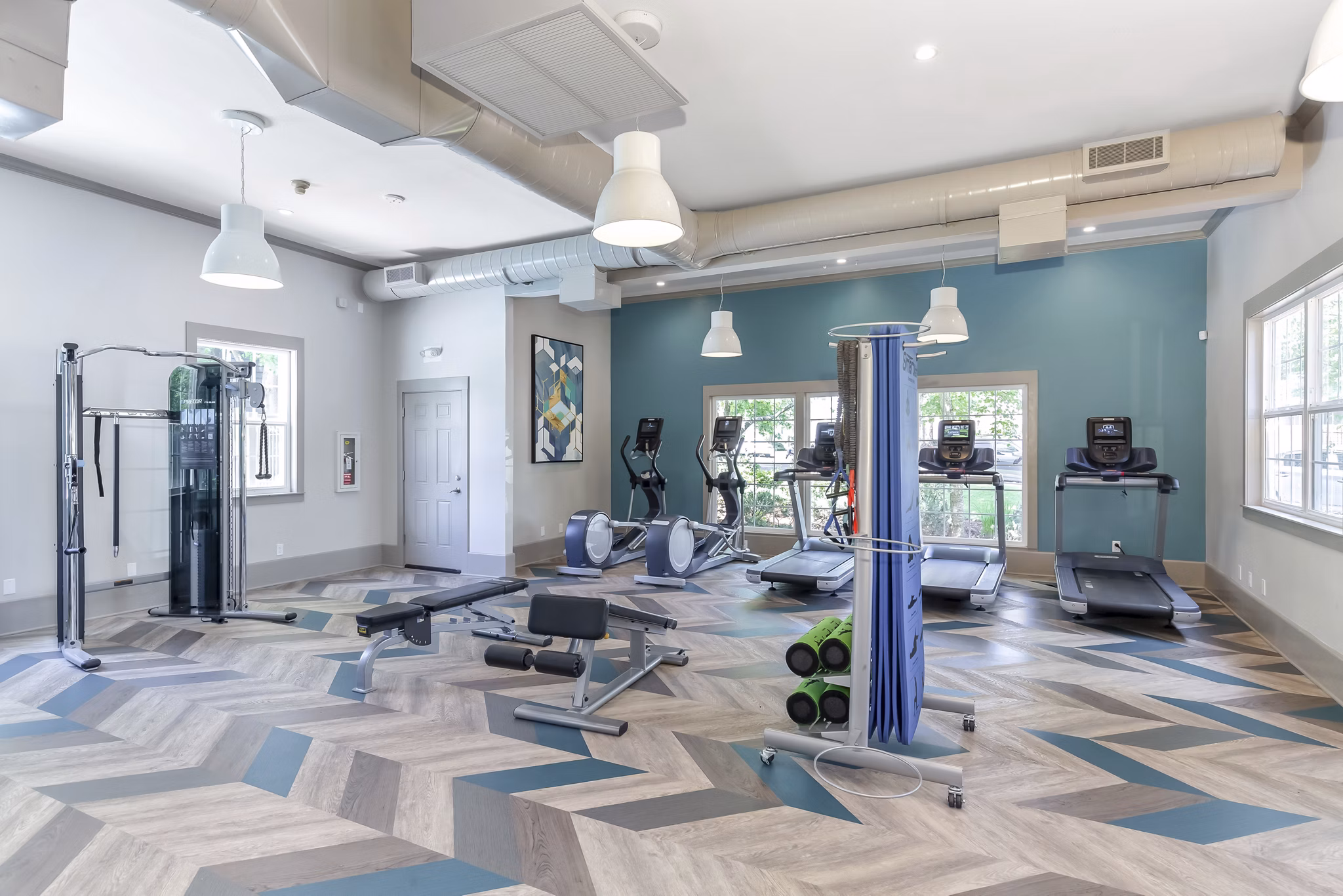 Modern fitness center with state-of-the-art equipment at Alaire Apartment Homes