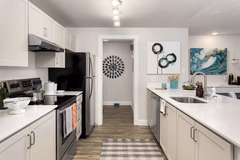 Modern kitchen featuring stainless steel appliances at Alaire Apartment Homes
