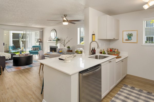 Modern kitchen with stainless steel appliances in Alaire Apartment Homes