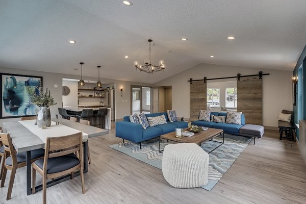 Spacious living room with modern furnishings in Alaire Apartment Homes