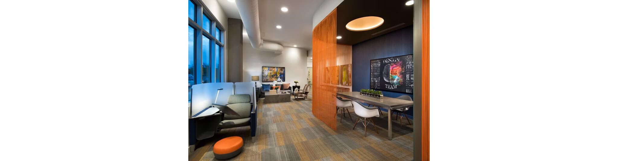 Clubhouse featuring modern decor and seating in Nexa Apartments