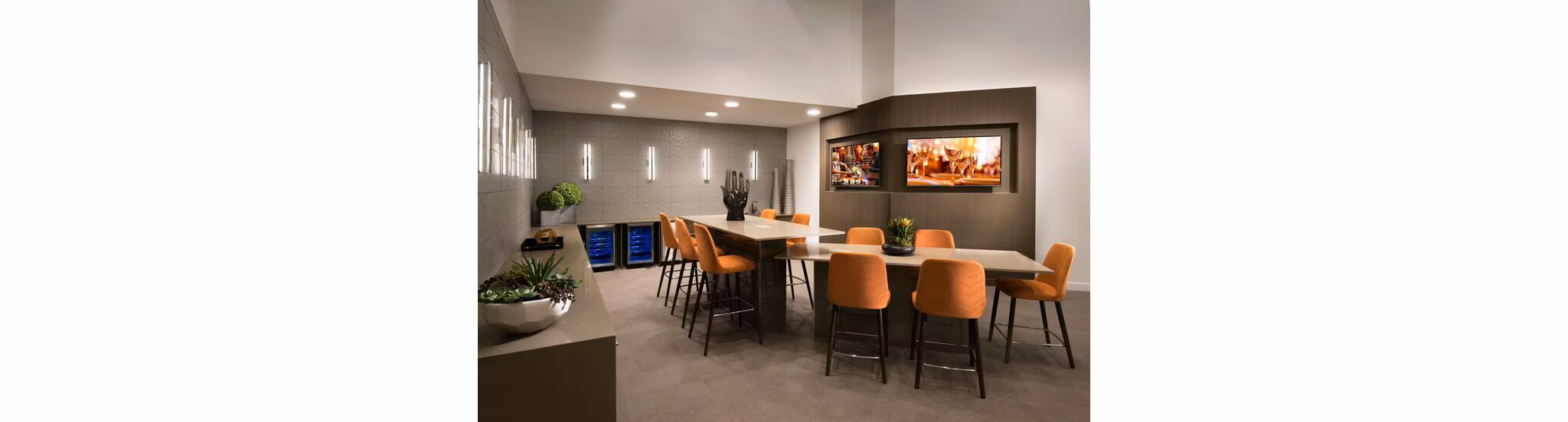 Clubhouse lobby featuring modern decor and seating at Nexa Apartments