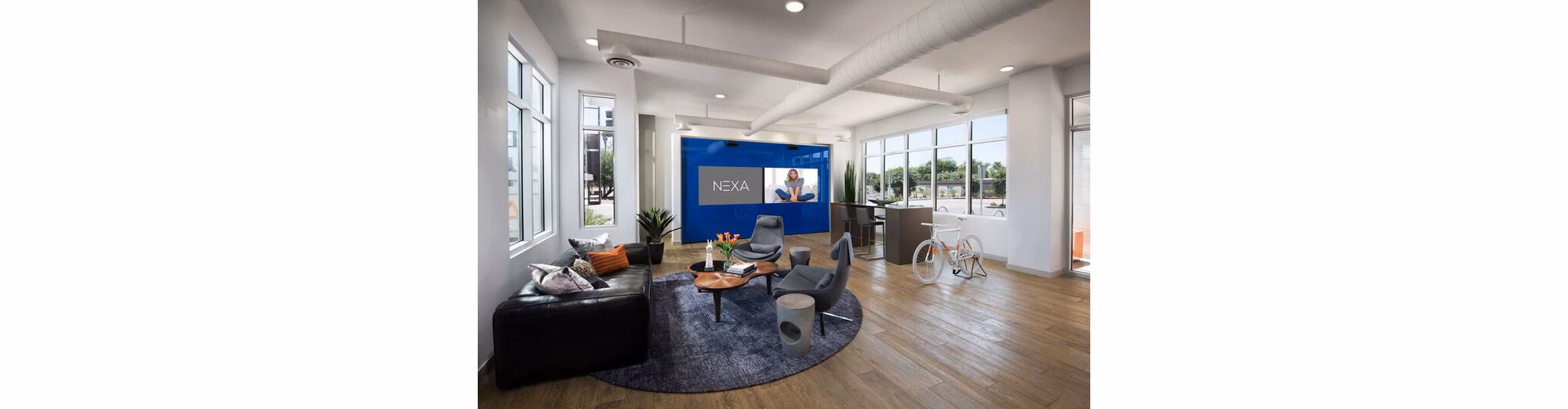 Elegant clubhouse lobby with modern furnishings at Nexa Apartments