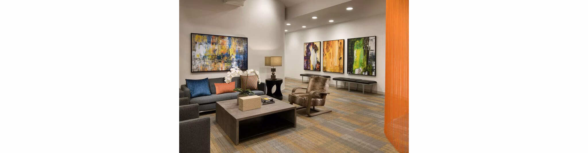 Nexa Apartments: Stylish clubhouse lobby with modern decor and seating areas