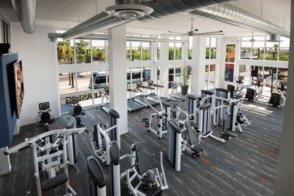 State-of-the-art fitness center at Nexa Apartments with cardio machines and free weights