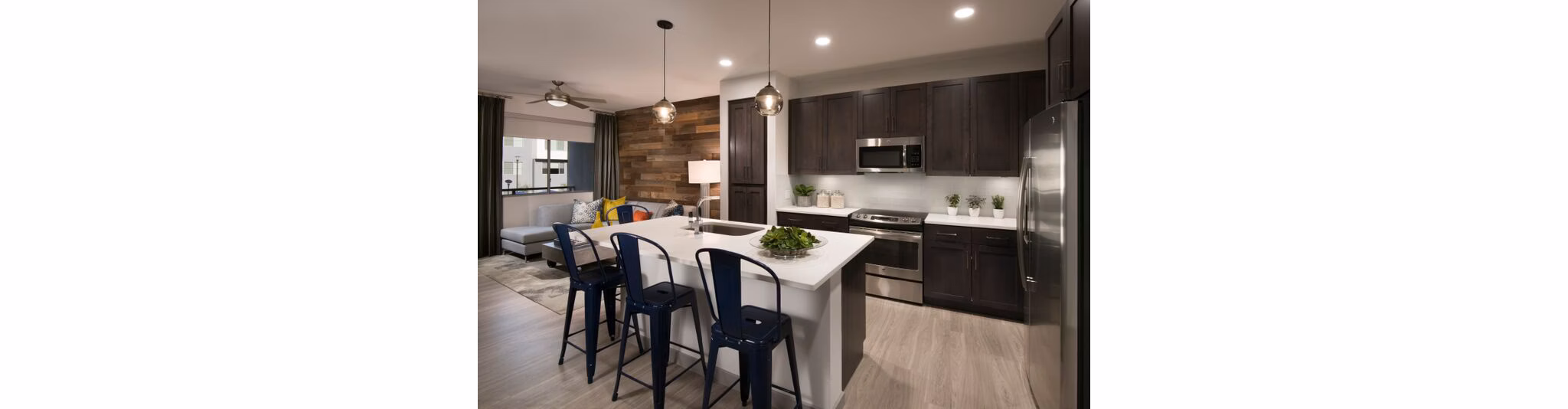 Modern kitchen with sleek countertops and stainless steel appliances at Nexa Apartments
