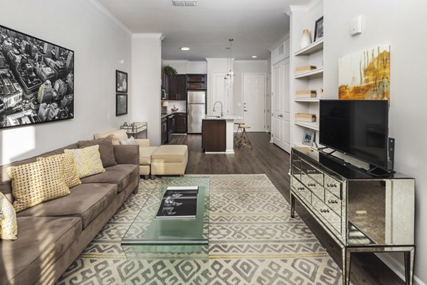 Spacious living room with contemporary design at Ardmore & 28th Apartments, featuring sleek furniture and natural light Luxury apartment living