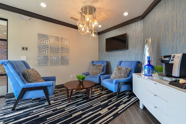 Clubhouse featuring modern design and spacious seating at CB Lofts Apartments