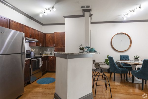 Contemporary kitchen with granite countertops in CB Lofts Apartments