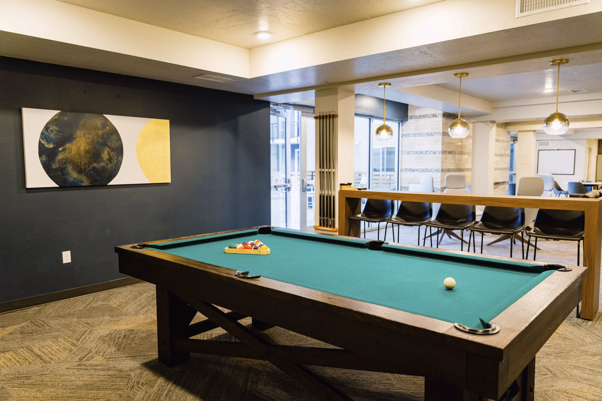 Clubhouse featuring modern design and communal seating at Milagro Apartments