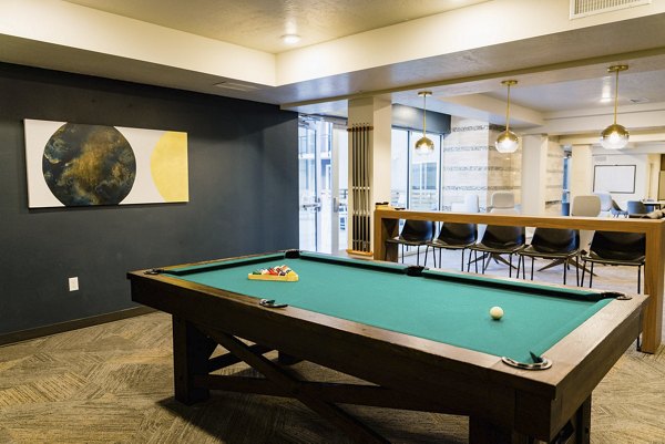 Clubhouse featuring modern design and communal seating at Milagro Apartments