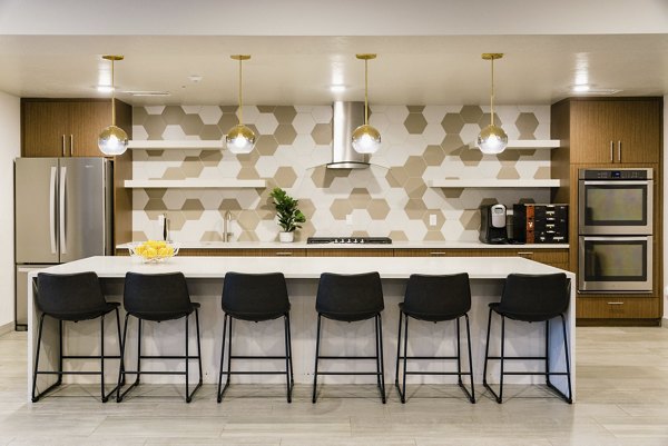 Dining room with contemporary decor and elegant lighting at Milagro Apartments