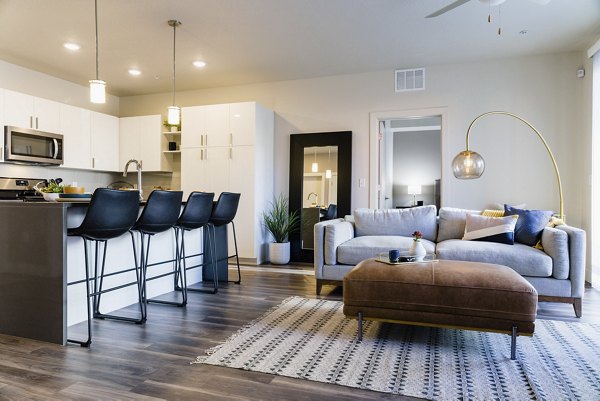 Modern kitchen with stainless steel appliances in Milagro Apartments