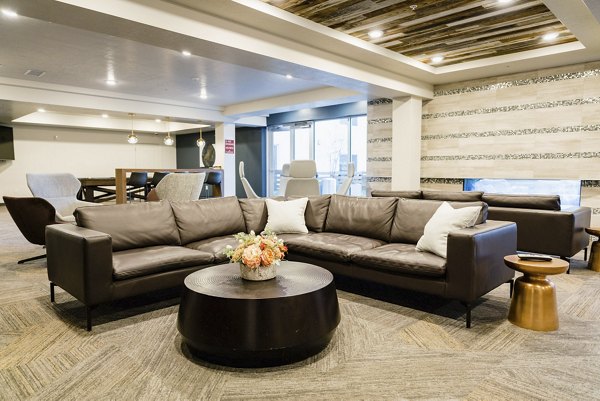 Spacious living room featuring modern furnishings at Milagro Apartments