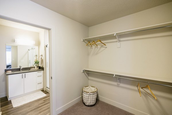 Laundry room with modern appliances at Milagro Apartments in Greystar luxury community