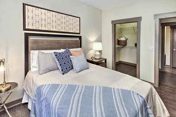 Modern bedroom with stylish decor at Cedar Flats Apartments in a Greystar luxury community