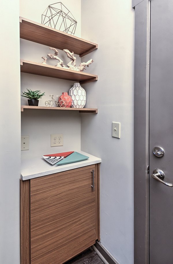 Open-concept kitchen with stainless steel appliances at Cedar Flats Apartments