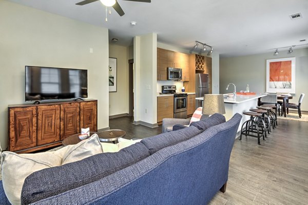 Living room featuring contemporary design and cozy seating at Cedar Flats Apartments