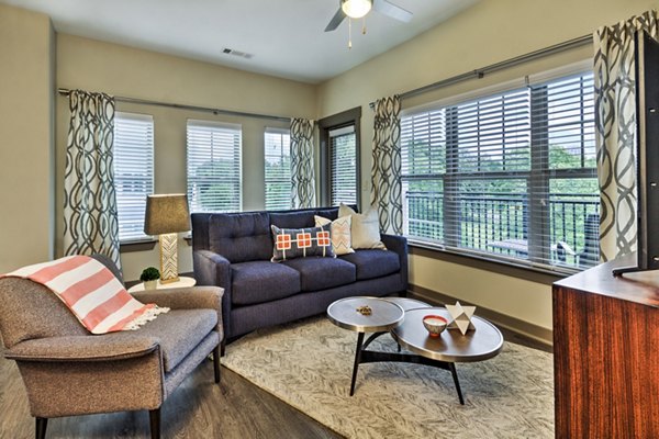 Spacious living room with modern furnishings at Cedar Flats Apartments in Charlotte