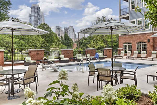 Relaxing poolside retreat at Cedar Flats Apartments offering luxury amenities and stylish outdoor seating for residents