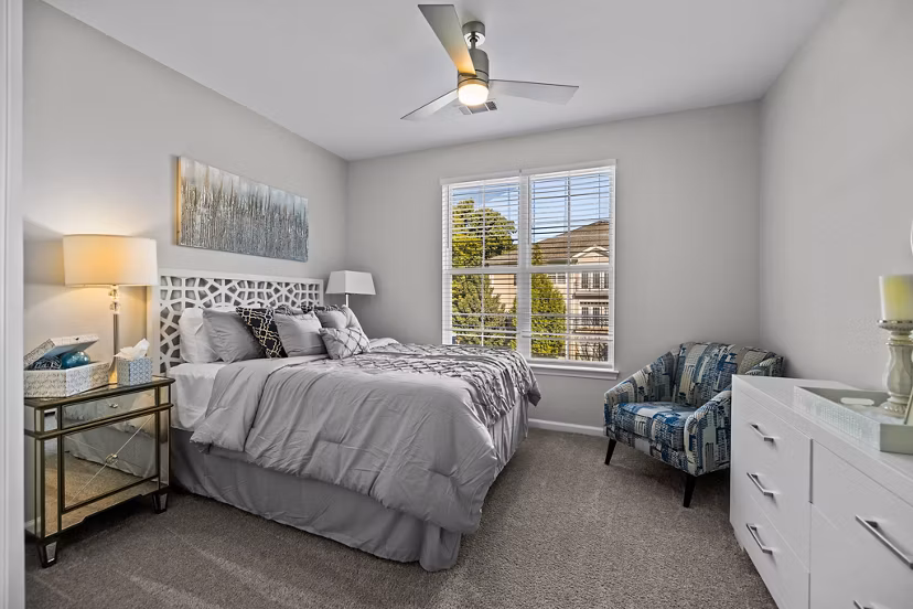 Bedroom featuring elegant design and modern furnishings at Magnolia Heights Apartments, a Greystar luxury living community