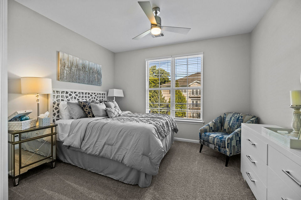 Bedroom featuring elegant design and modern furnishings at Magnolia Heights Apartments, a Greystar luxury living community