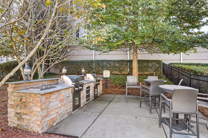 Modern dining area with elegant lighting and hardwood floors in Magnolia Heights Apartments, offering a luxurious living experience