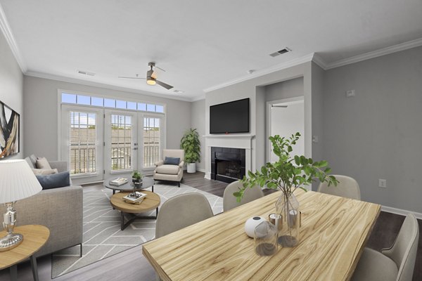 Modern dining area with elegant lighting and hardwood floors in Magnolia Heights Apartments, offering a luxurious living experience