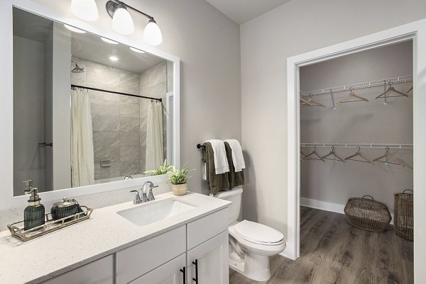 Luxurious bathroom featuring a modern vanity and sleek tile design in Satori West Ashley Apartments