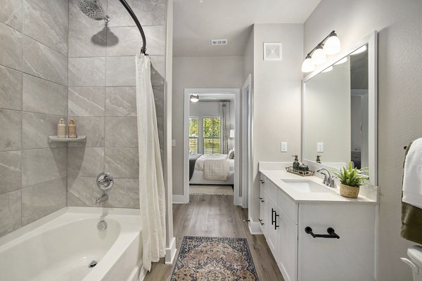 Luxurious bathroom with modern fixtures at Satori West Ashley Apartments