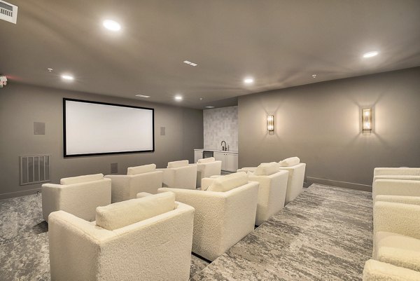 Clubhouse lounge featuring modern decor and cozy seating at Satori West Ashley Apartments