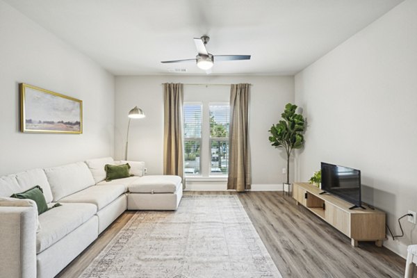 Contemporary clubhouse featuring comfortable seating and modern decor at Satori West Ashley Apartments