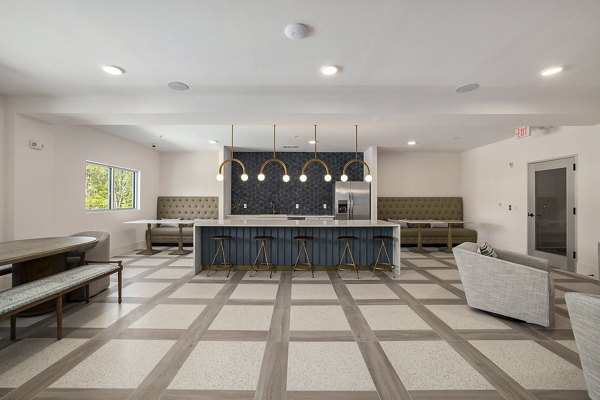 Upscale clubhouse with modern decor at Satori West Ashley Apartments offering luxury amenities