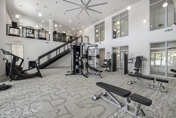 Fitness center with state-of-the-art equipment at Satori West Ashley Apartments, promoting health and wellness in a luxury living environment